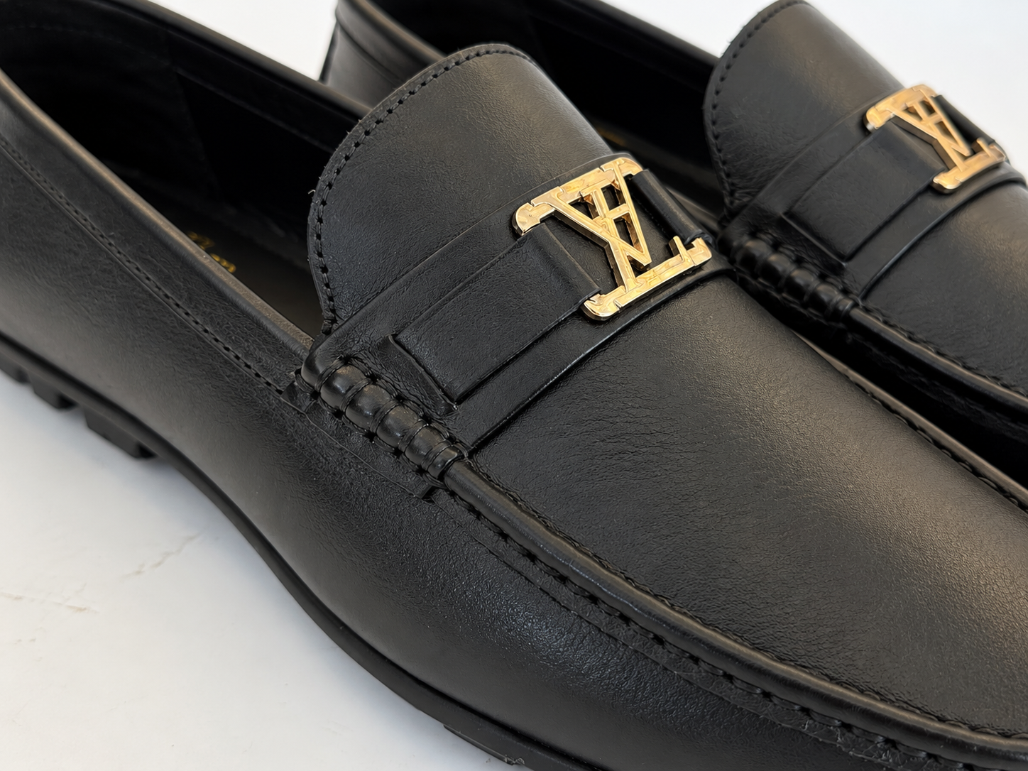 Elite Evoke – Noir Signature Gold Emblem Leather Loafers