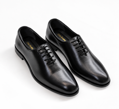 Elite Evoke – Noir Royale Wholecut Oxfords